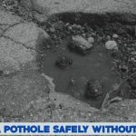 What Should you do to get over a pothole safely if you cant swerve around it